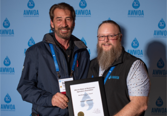 Dennis Tomuschat, 2025 Ron Bayne Service Award Recipient, Presented by AWWOA Chair, Chris Huston